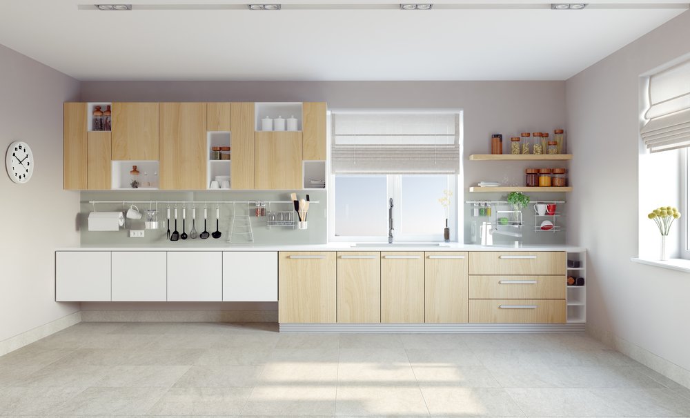 Een keuken wordt afgebeeld met vernieuwde kastdeuren na het wrappen, wat een betaalbare en effectieve manier is om een nieuwe uitstraling aan de keuken te geven.